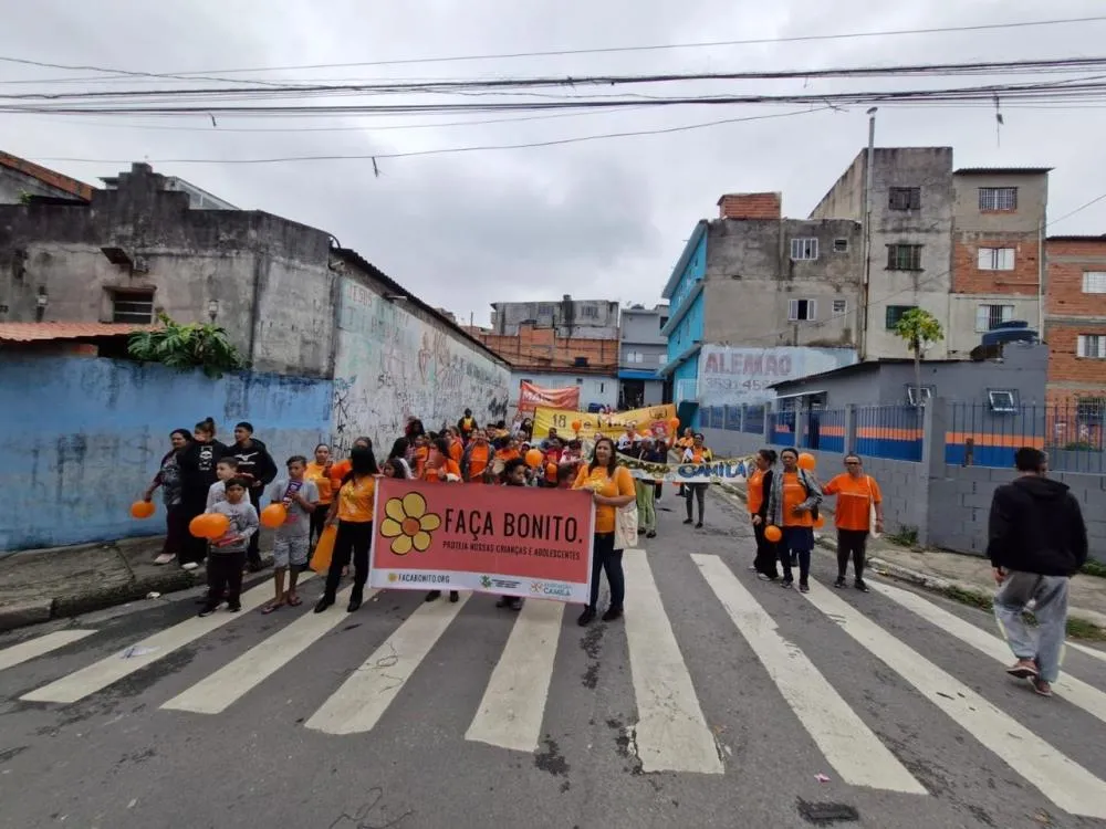 Caminhada do Maio Laranja mobiliza comunidade em defesa da infância no Jardim Conceição e Primeiro de Maio